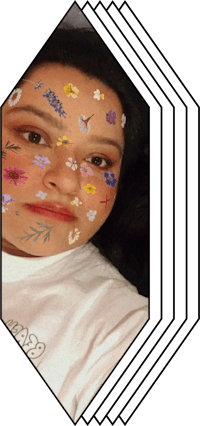 a woman with flowers painted on her face